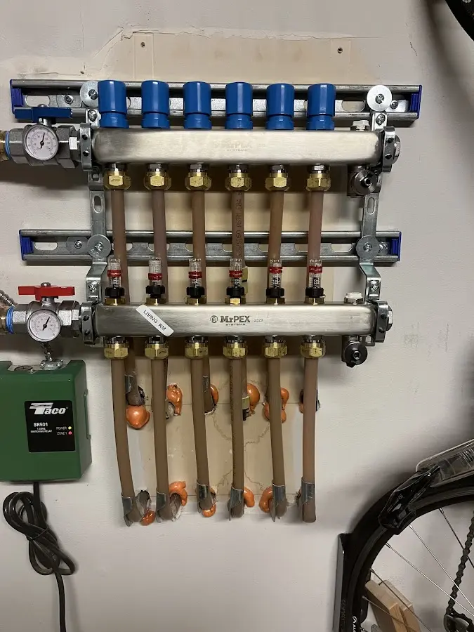 Plumber performing Water Heater Repair at a residential property in Des Moines